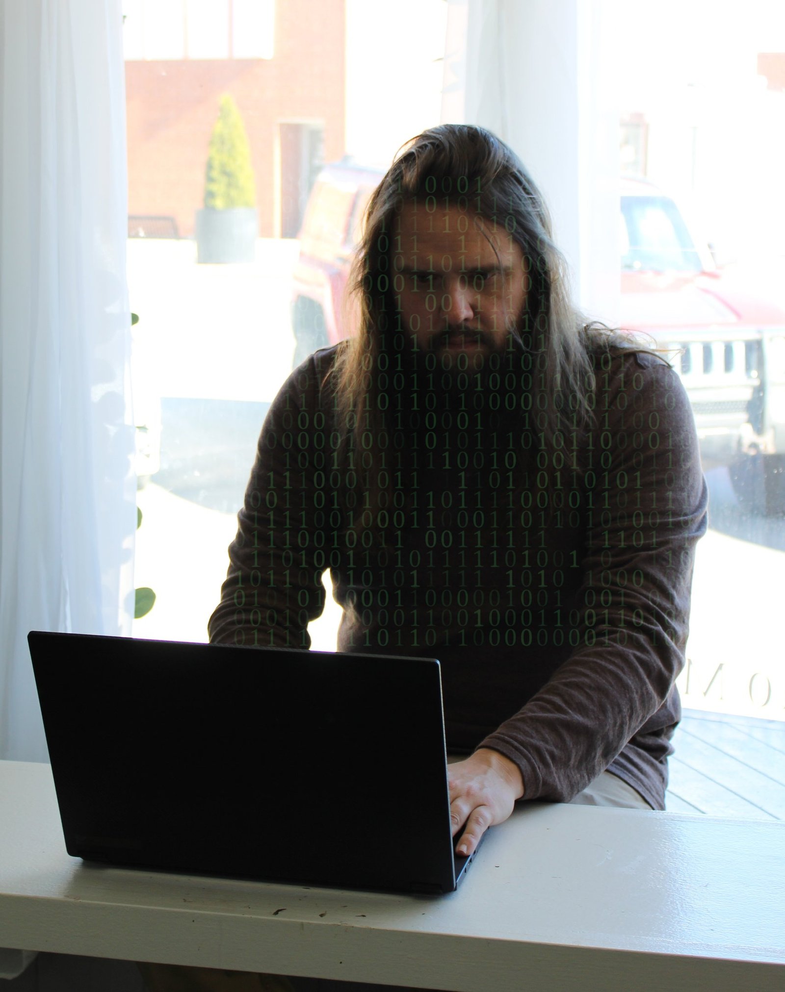 Justin working on fixing IT and network problems.